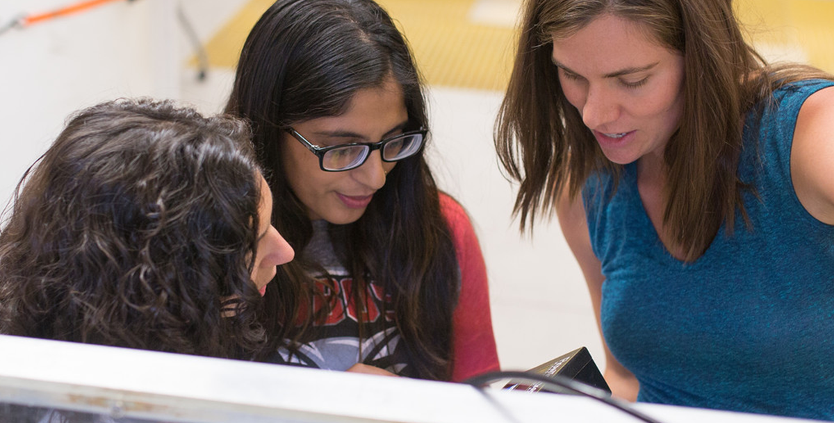 photo: woman working on robotics