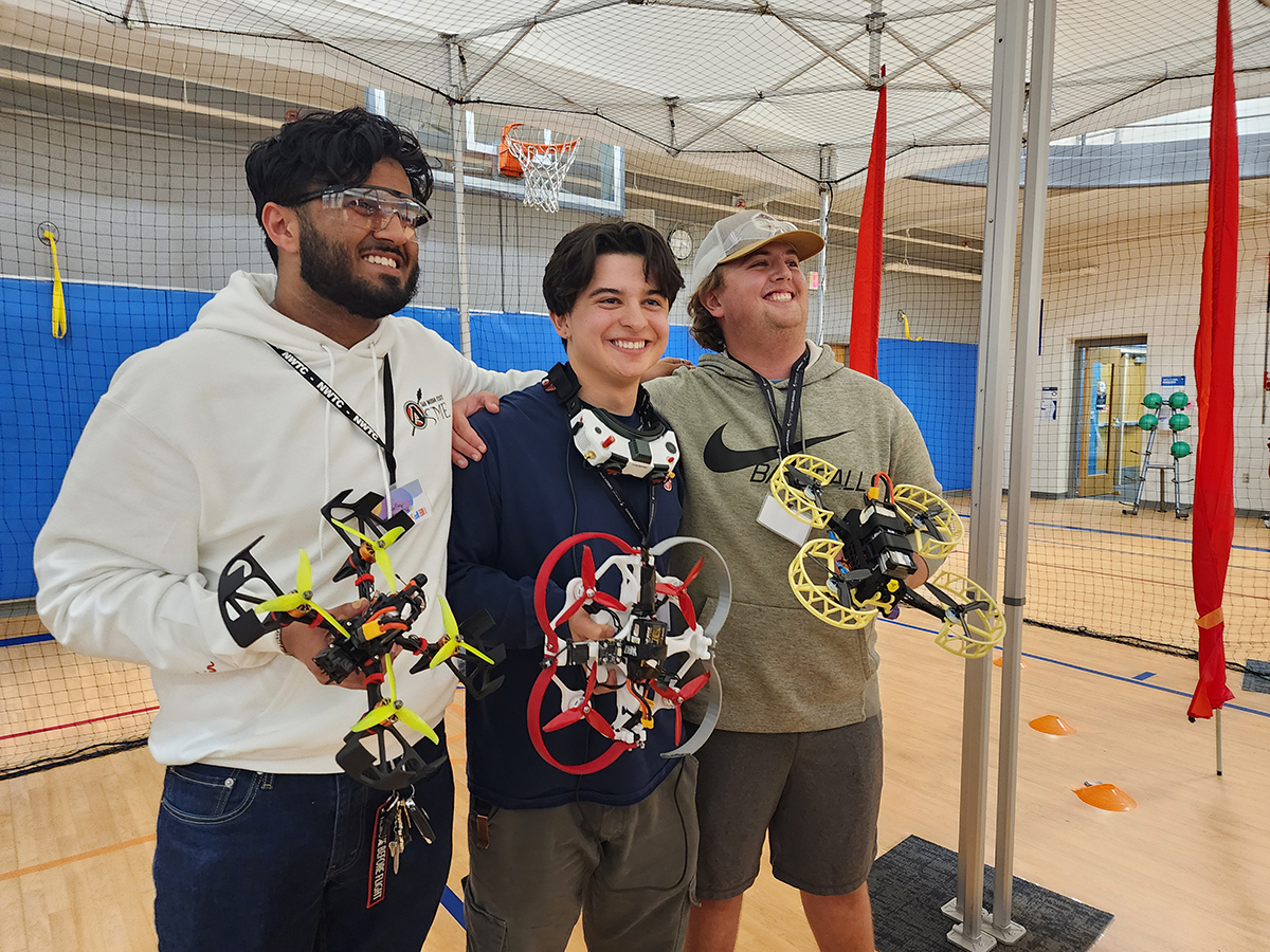 photo: Members of UNM’s ASME student group pose with their winning projects.