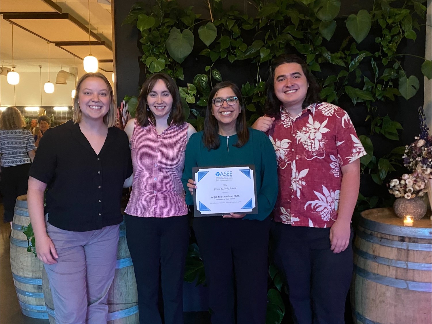photo: Anjali Mulchandani holds her award at the ASEE conference with (from left) Sydney Donohue Jobe, Kamryn Zachek and Ethan Kapp.