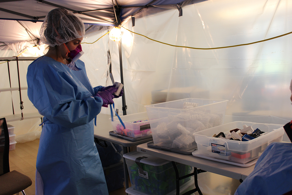photo of a woman making masks for the COVID-19 epdidemic