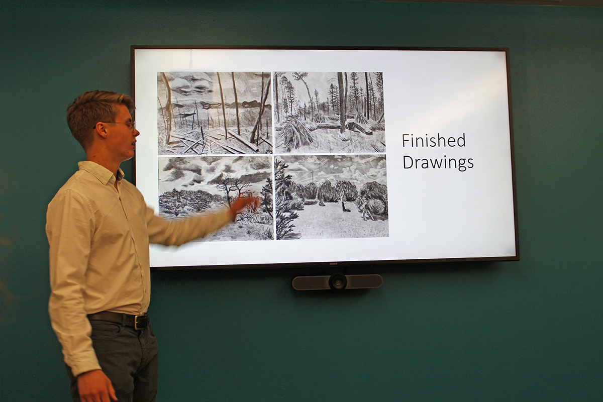 Photo: William Crockett, a student in biology and physics, talks about his timelapse series of drawings about New Mexico’s ecosystems.
