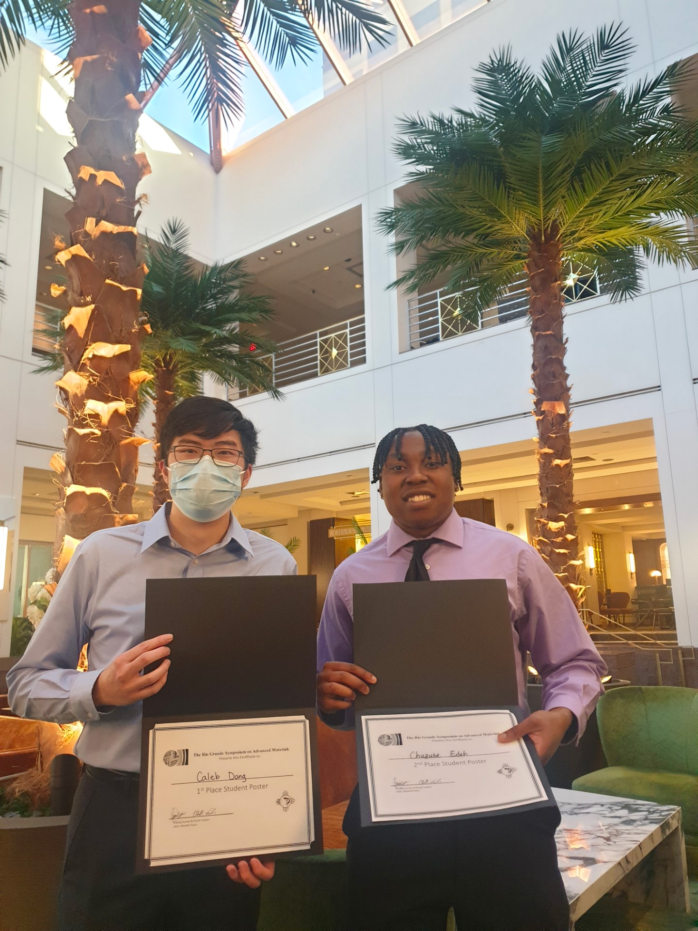 Photo: Two of the UNM winners, Caleb Dang and Chuzube Edeh, pose with their awards.
