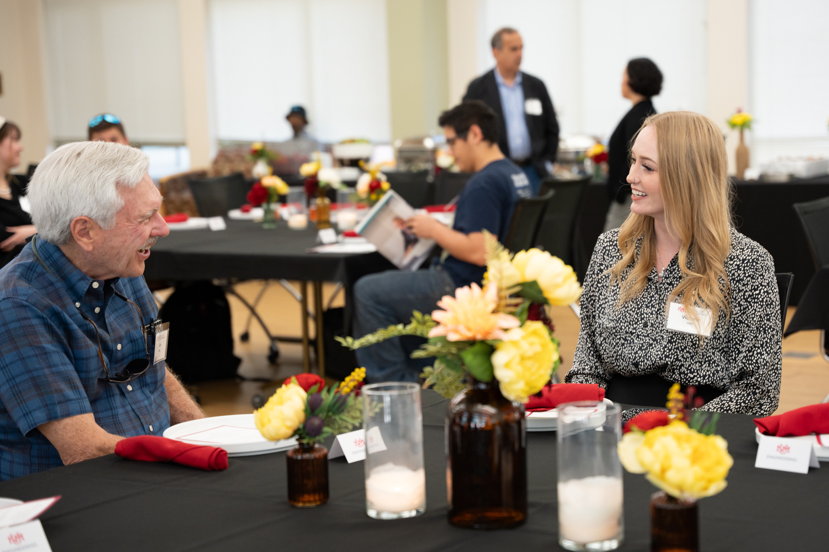 photo: donor and student talking at the ME luncheon