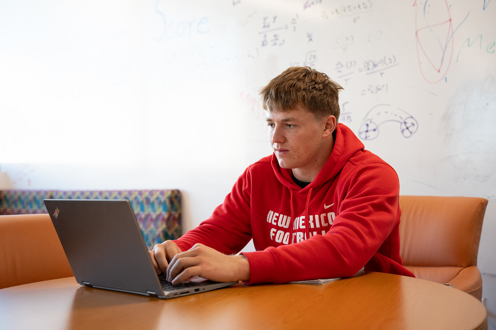 photo: Mercury Swaim sitting at his laptop